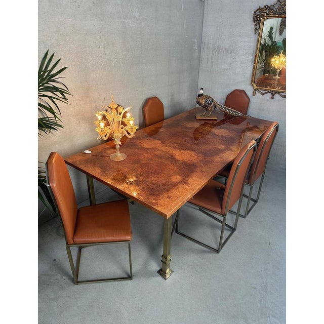 Large dining table with 6 chairs. Original seventies design Belgochrom. Hollywood Regency. Gold-colored metal frame for...