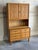Beautiful vintage Danish hutch cabinet crafted in oak in style of Henning, featuring elegant carved geometric panel doors...