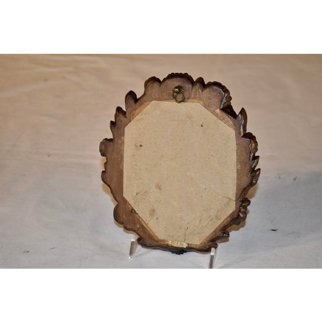 19th century small hand carved wall mirror. The frame is made from fruitwood, which has been wonderfully hand-carved with...