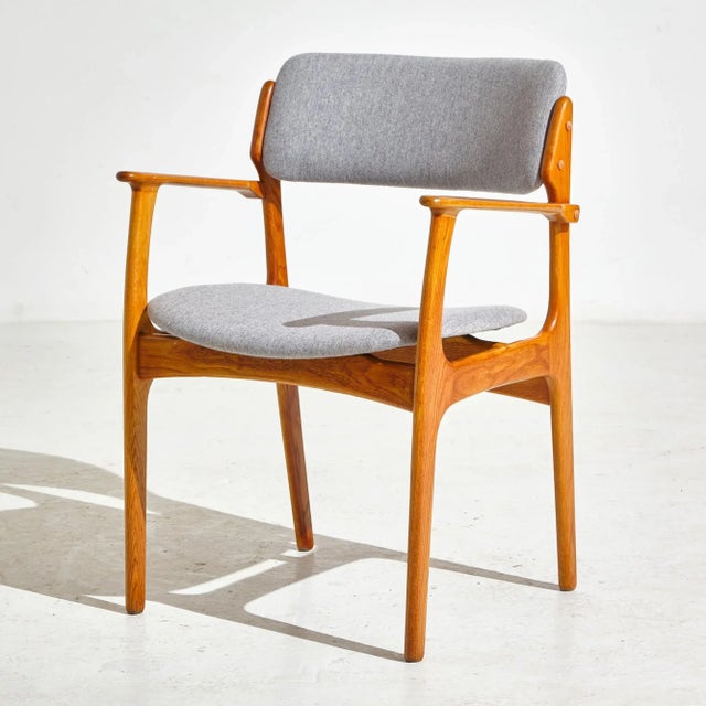Completely restored ‘Model 49’ oak armchair with fresh wool upholstery. Designed by Erik Buch for O.D. Møbler in the 1960s.