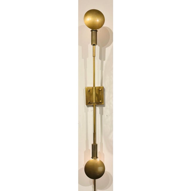 Original retail $1400, stylish Revelation Modern Antique Brass Polar Sconces Pair, showroom floor samples