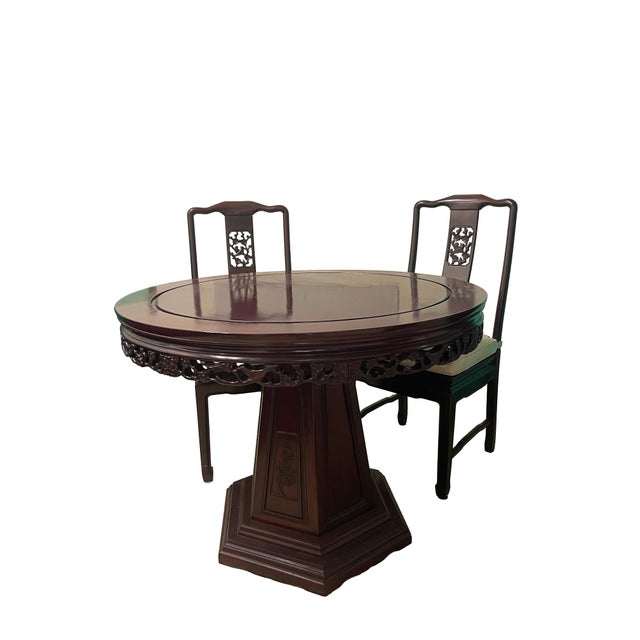 This exquisite round dining table set is intricately carved in cherry blossom and bird motif, symbolizing happiness and...
