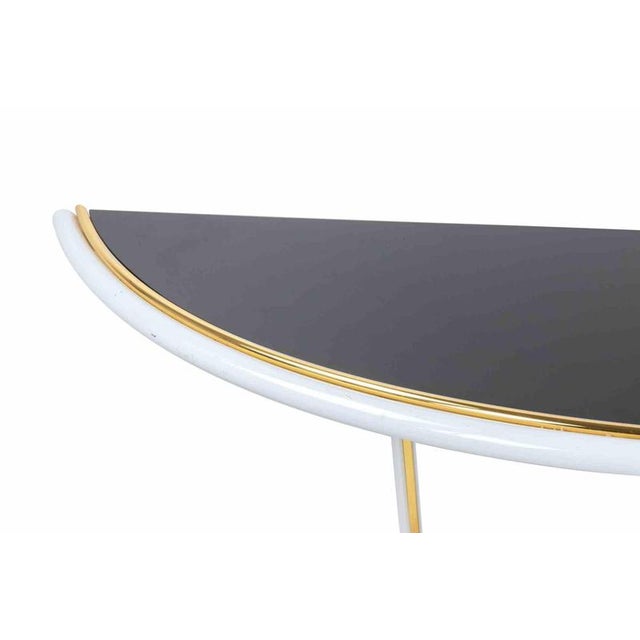 Vintage Console with Wall Mirror is an original design furniture realized by Tommaso Barbi in the 1970s. Lacquered Metal,...