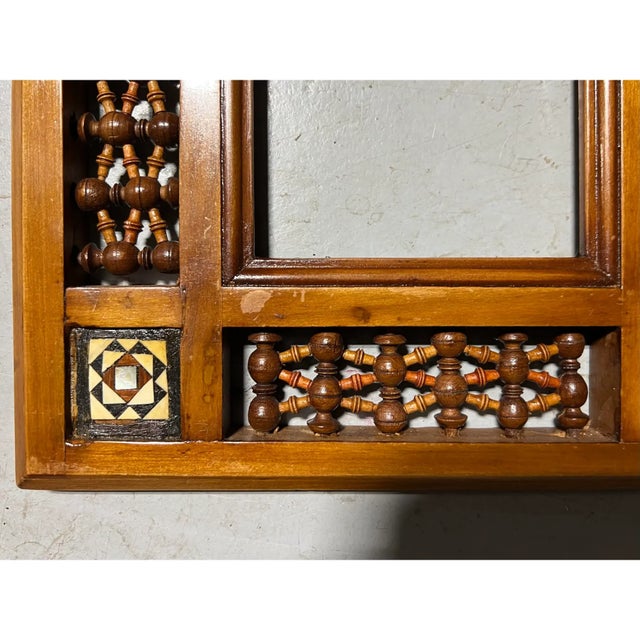 A pair of ornately carved and pierced picture frames circa 1940. Corners are inlaid with mother of pearl. The windows...