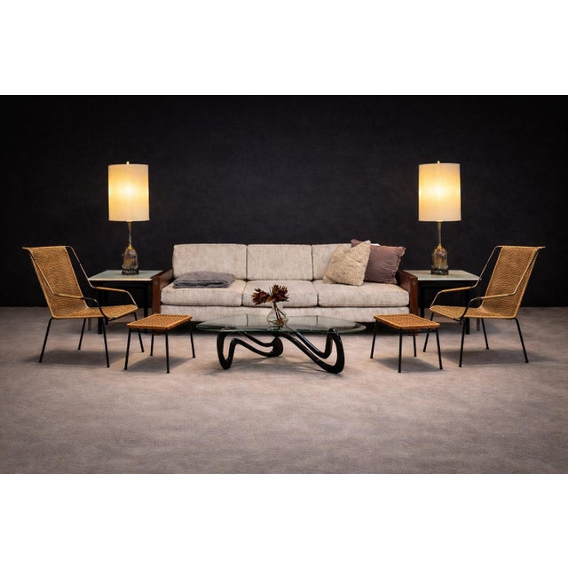 Designed by Carlo Hauner in the 1950s, this set of two armchairs with their corresponding stools reflects the designer’s...
