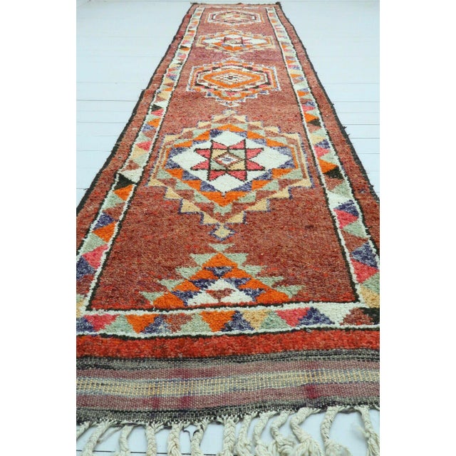 This gorgeous hand knotted Vintage Anatolian area rug is approximately 60 years old in excellent vintage condition. The...