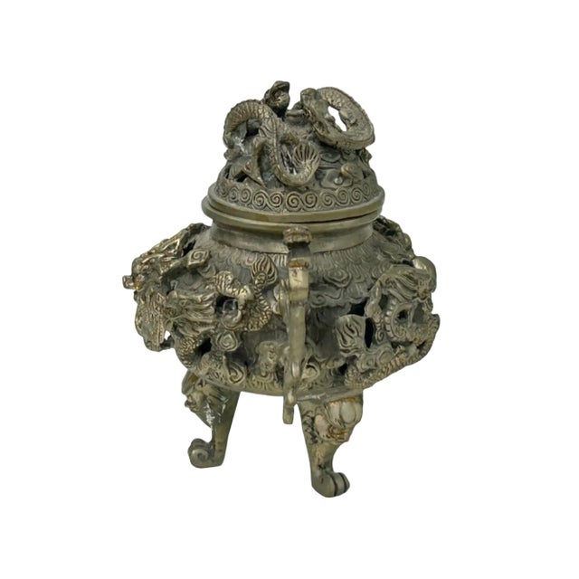Immerse your home in an aura of ancient mystique and refined elegance with this breathtaking metal incense censer....