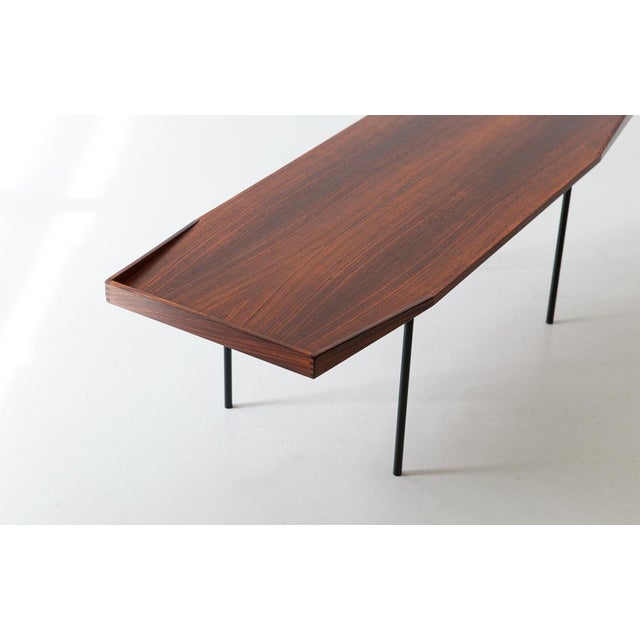A low and large table manufactured in Italy during the 1950s As we normally prefer, the original finish has been...