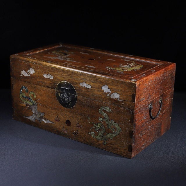 A beautifully crafted Chinese rectangular box, likely made of Huali (rosewood). The box features a hinged lid with brass...