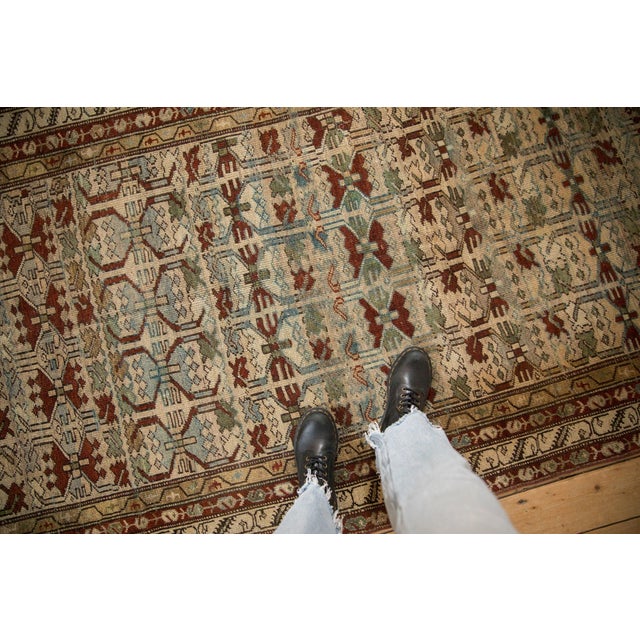 :: Covered field in geometric floral blossoms in pomegranate relief. Inner border in a meandering vine, with minor borders...