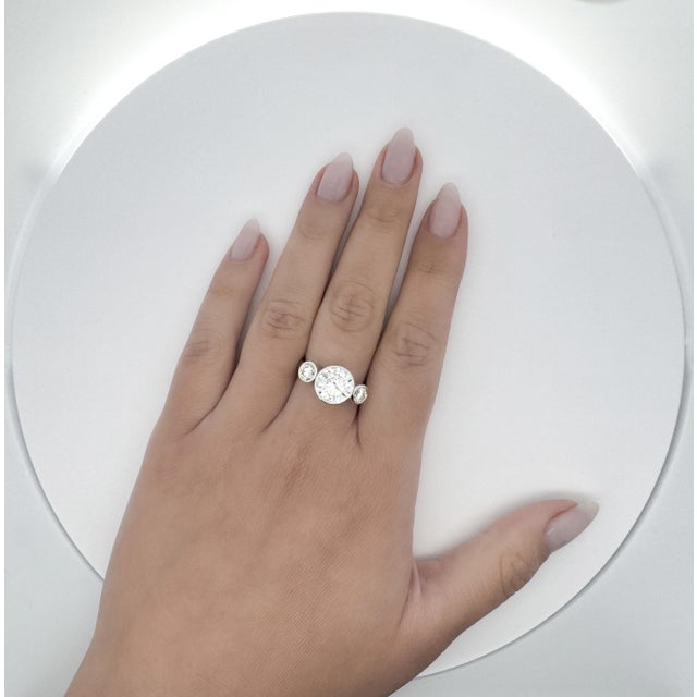 Ready to ship three stone engagement ring sets an IGI Certified 3.17 carat round cut lab grown diamond with 1.25 carats in...