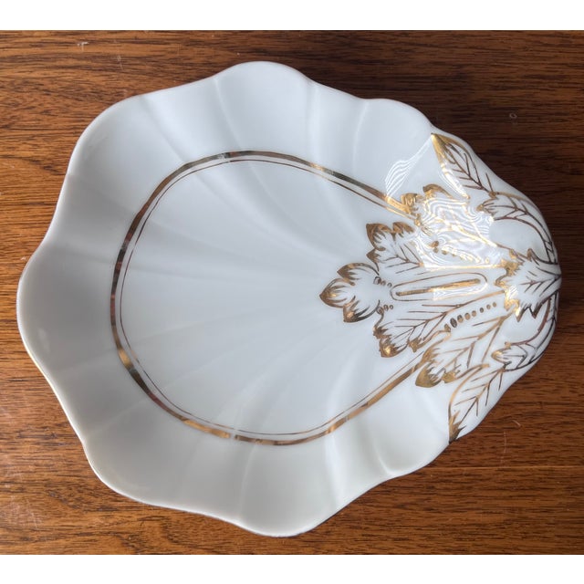 This lovely matched pair of vintage gilt French Porcelain relish dishes are in a classic shell form. Can be used for...