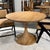 Modern table blends iconic form with artisan warmth. Handcrafted from mahogany and finished in Antique French Oak, this...