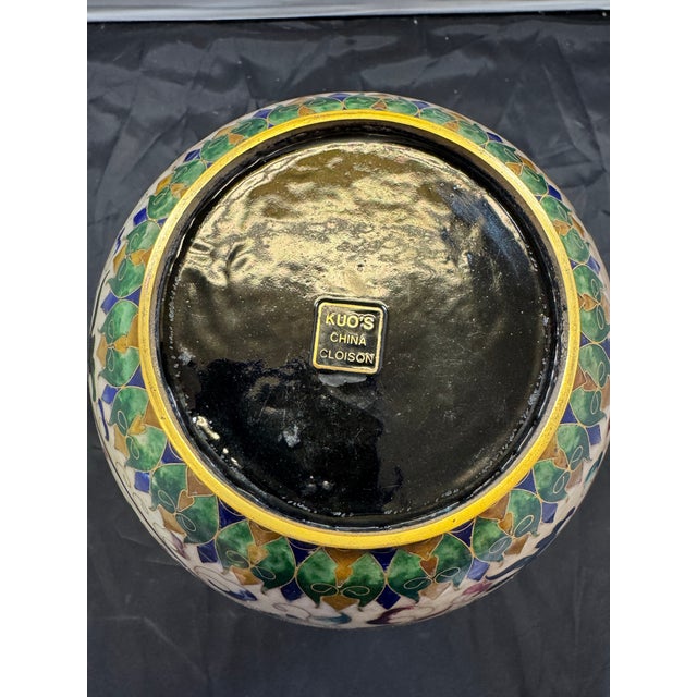 The product is a vintage 12" Chinese Cloisonne vase featuring intricate floral vines in cream enamel, signed by artist...