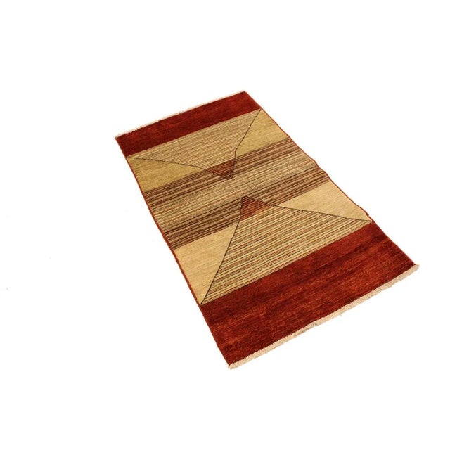 With strict standards of craftsmanship and quality of materials used this modern inspired hand knotted gabbeh rug is a...