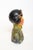 Circa 1930s polychrome chalkware bust depicting an Asian woman in traditional attire, created in the style popularized by...