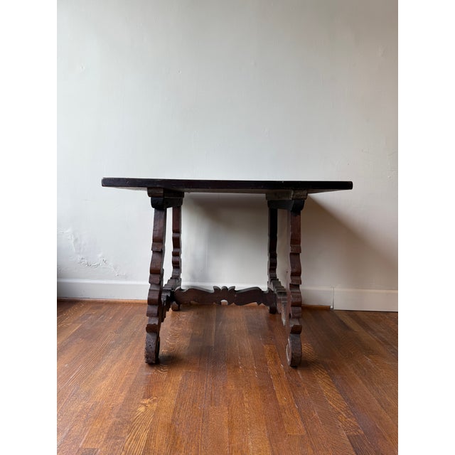 Crafted from rich, antique walnut, this dining table combines timeless elegance with durable construction. Its solid wood...
