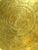 A vintage round brass tray with floral engraving surrounding a central decorative medallion. Repeating small motifs...