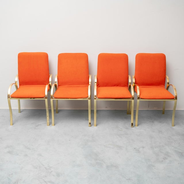 Set of 4 1970s chairs. Gold-plated metal frame. Orange fabric upholstery. Excellent condition with signs of wear, as shown...
