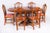 This is a beautiful Regency Revival flame mahogany and satin wood banded oval dining table made by the Master Cabinet...