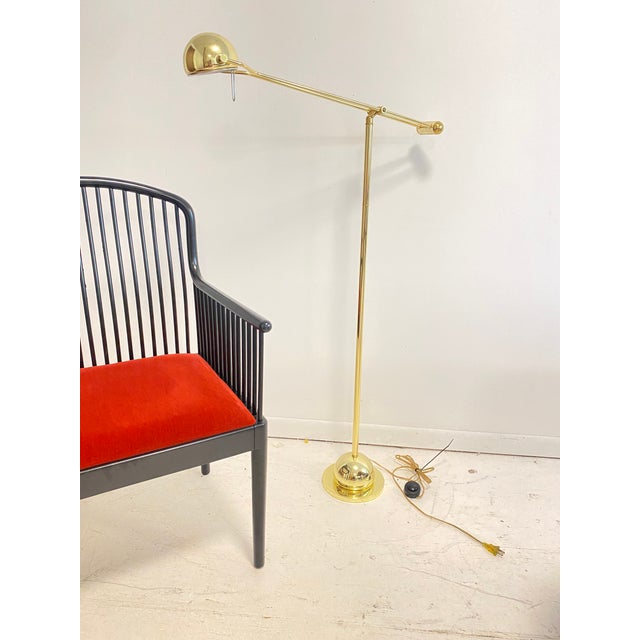 Eye catching in gold with a highly polished and sleek modern design. Finish is in excellent condition. Floor button switch.