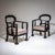 Pair of dark brown stained armchairs with balloon-shaped openwork backrests and upholstered seats. The seats have been...