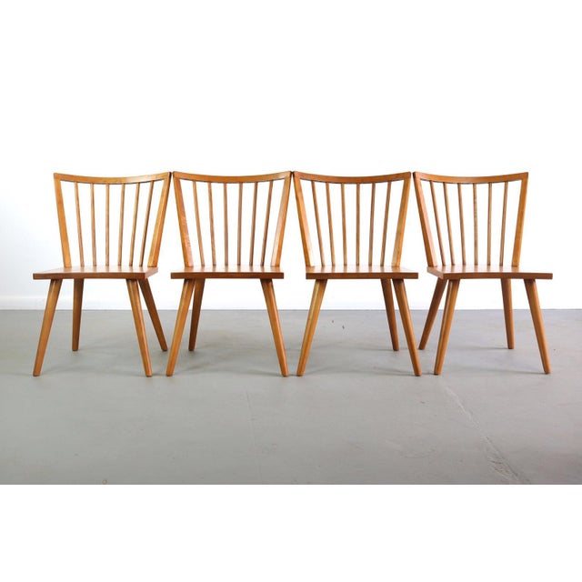 A fantastic set of 4 maple dining chairs. Warm and beautiful grain with spindle backs. The set is in great vintage...