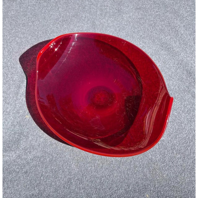 Mid-Century modern serving plate with a rich deep red color. There’s a cool curvature/moving swirl design to it that I...