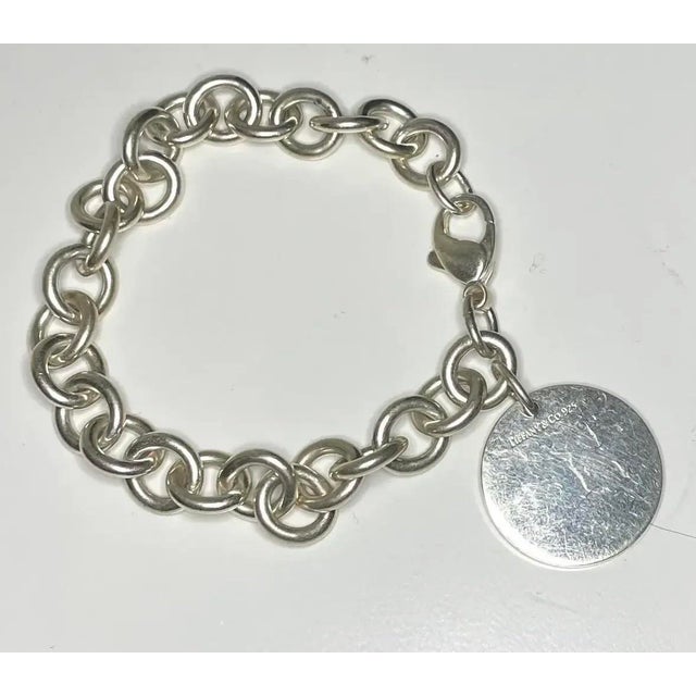 A timeless Tiffany & Co. classic from the 1990s, this substantial sterling silver bracelet features a beautifully weighted...