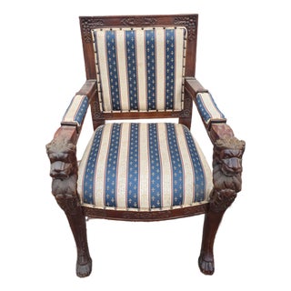Early 20th Century Victorian Carved Armchair with Lion Head Arms and Claw Feet For Sale