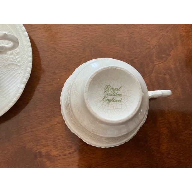 Beautiful set of eight tea cups and saucers from the Avery collection by Royal Calden made in England. The distinctive...