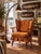 A mid-century spring rocking chair in the Colonial Revival tradition, with a beautifully articulated wood frame and strong...