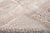 Softness you can see: a surface of shifting tones, like morning light on raw stone. An ivory ground mingles with light...