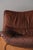 Low, wide three-seater sofa in solid elm and leather, France, 1960s-70s, by Maison Regain. It seats three to four people...