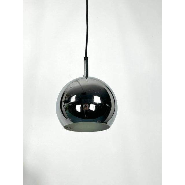 Excellent vintage condition for this set of two pendant lamps produced by Targetti during the 70s. Made from chrome....