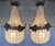 This elegant pair of circa 1960s French Louis XVI–style chandeliers combines solid bronze construction with an unusual...