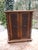 An antique, small model cabinet in a very distinctive and detailed design. The key works again and, like the nameplates,...