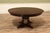 Large 64"-84" Cherry Jupe table with acid-washed brass accented feet. Casual medium brown finish. This table has self-...