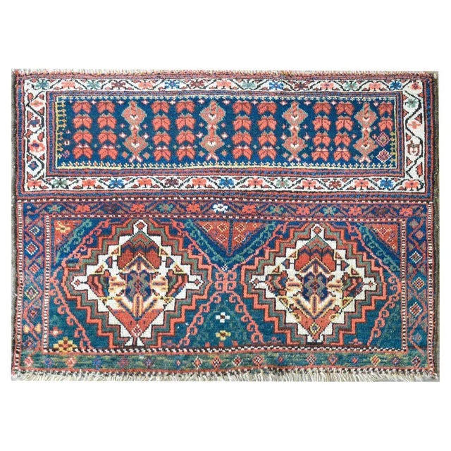 A wonderful and expertly crafted early 20th century Persian Malayer bag face rug with two large stepped diamond medallions...
