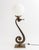 Art Deco Bronze Scroll Form Lamp, with white glass ball form shade on square base. 28.25" H x 9" W x 7.5" D. Provenance:...