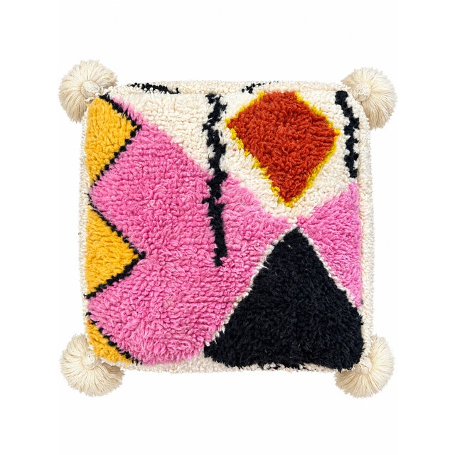 Moroccan floor pouf made from an abstract midcentury rug handwoven in ivory, black, yellow and camellia pink hand spun...