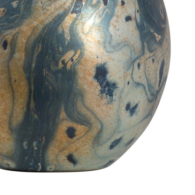 Feel the cares of the world fall away when looking at the mesmerizing swirls of silver and teal over the glass of this 27"...