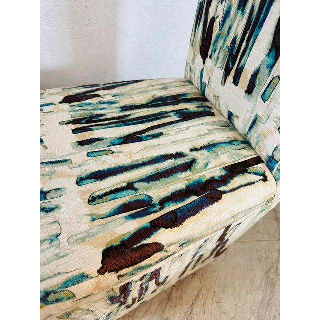 This is a stylish pair of vintage high-back accent chairs with a sleek, architectural silhouette. The chairs feature tall...