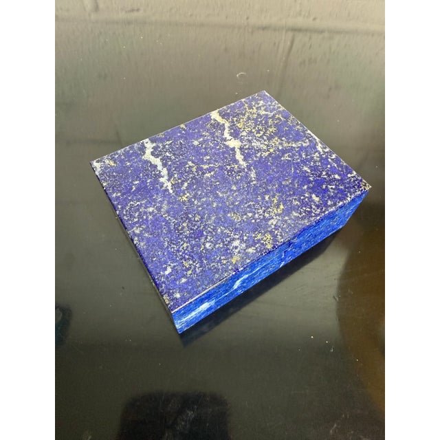 Lovely fine Italian box made of lapis lazuli, lined in what appears to be black marble and velvet and opens with a...