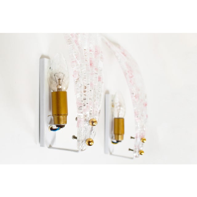 Pair of Italian Murano glass wall lamps, produced during the 1980s. Both are in very good and undamaged condition, with...