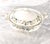 This is a round covered vegetable bowl by Royal Albert in Brigadoon. The piece is bone china from 1980. It is shiny white...
