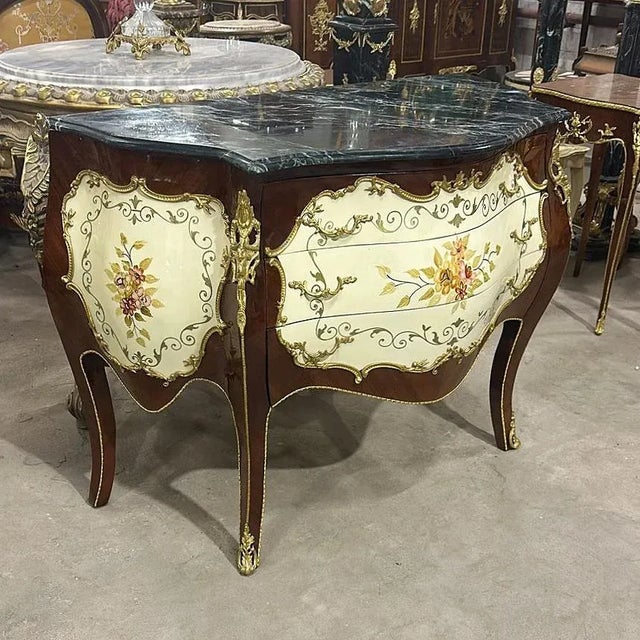 Art stands out in every corner of this copper commode, it has 3 drawers decorated with gold handles and a beautiful...