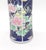 This striking 11" tall Japanese porcelain vase features a dramatic deep cobalt blue ground covered in an all-over gold...