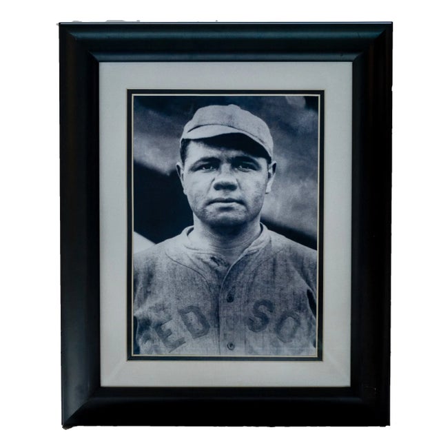 Black-and-white photographic portrait depicting Babe Ruth during his early career with the Boston Red Sox, prior to his...