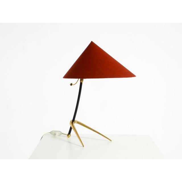 Beautiful, large, original mid-century modern brass designer table lamp with a tripod "crow's foot" base and a new red...